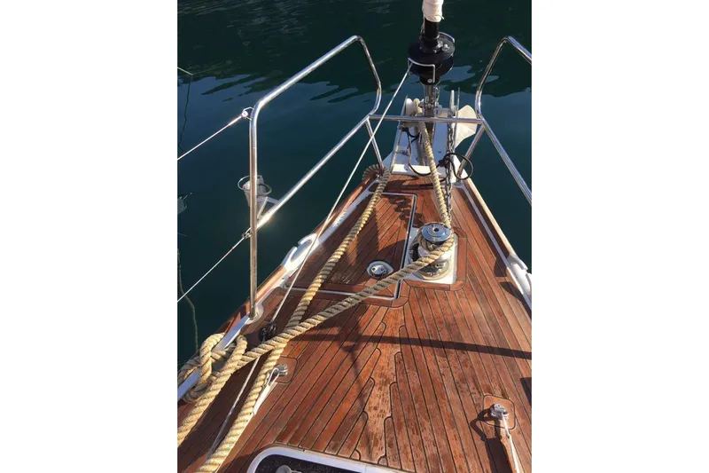 Yacht Photos Pics Bow of 2015 Jeanneau 57 yacht with teak deck and mooring ropes.