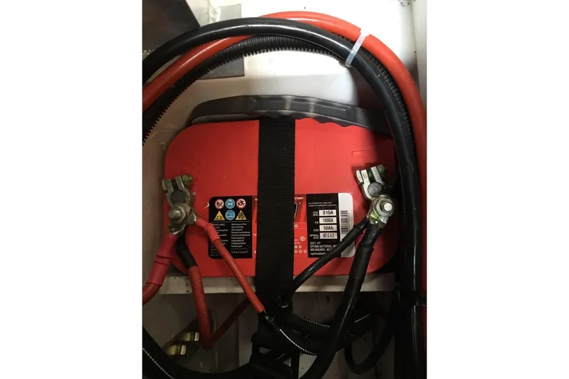  Yacht Photos Pics Battery compartment of 2015 Jeanneau 57 yacht with red cables and connectors.