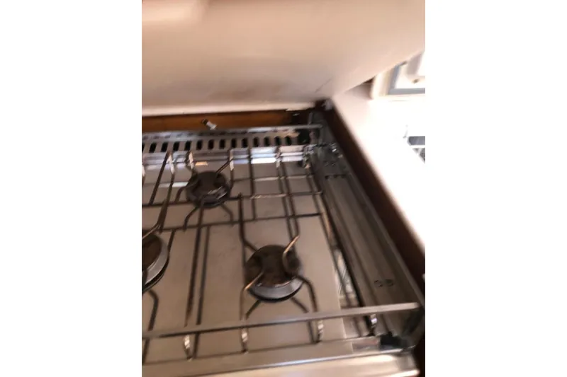  Yacht Photos Pics Stove inside 2015 Jeanneau 57 yacht, featuring three burners and stainless steel finish.