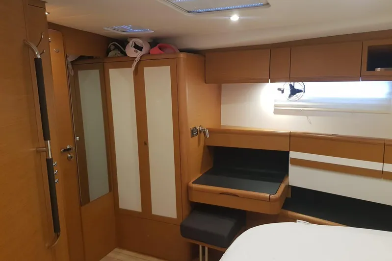  Yacht Photos Pics Interior of 2015 Jeanneau 57 yacht with wooden cabinetry and modern design.