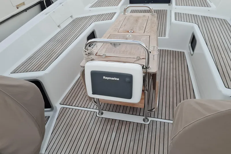  Yacht Photos Pics Cockpit of 2015 Jeanneau 57 yacht with teak flooring and Raymarine equipment.