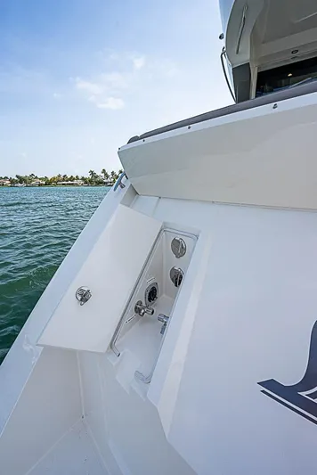  Yacht Photos Pics 2017 Carver C52 Coupe yacht detail with open compartment, ocean view, and clear sky.