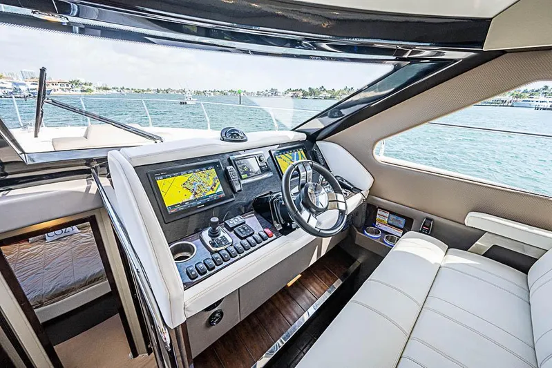  Yacht Photos Pics Interior of 2017 Carver C52 Coupe yacht with modern navigation system and luxurious seating.