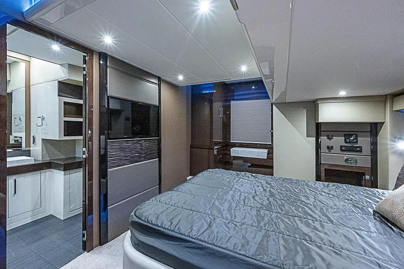  Yacht Photos Pics Luxurious interior of 2017 Carver C52 Coupe yacht with modern bedroom and bathroom.