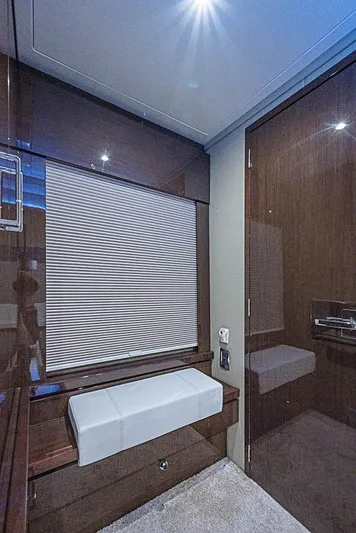  Yacht Photos Pics Interior of 2017 Carver C52 Coupe with sleek wood paneling and modern seating.