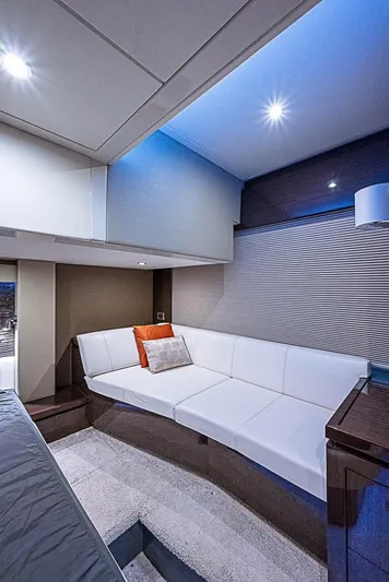  Yacht Photos Pics Luxurious interior of 2017 Carver C52 Coupe yacht with modern white seating and ambient lighting.