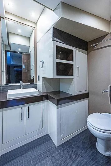  Yacht Photos Pics Luxurious bathroom in 2017 Carver C52 Coupe yacht with modern fixtures and sleek design.