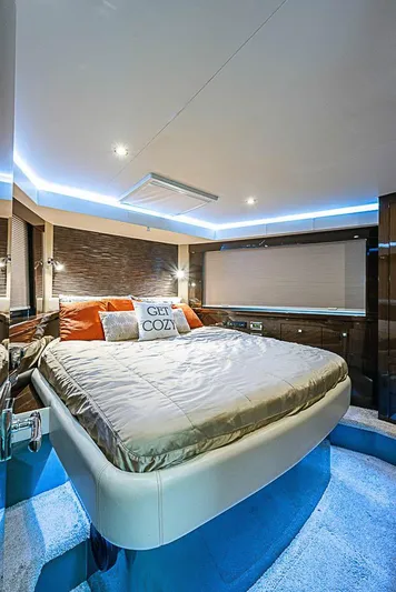  Yacht Photos Pics Luxurious bedroom interior of 2017 Carver C52 Coupe yacht with modern lighting and cozy bedding.