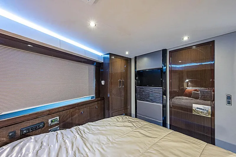  Yacht Photos Pics Luxurious interior of 2017 Carver C52 Coupe yacht bedroom with modern design and ambient lighting.