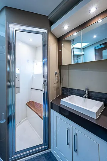  Yacht Photos Pics Luxurious bathroom in 2017 Carver C52 Coupe yacht with modern fixtures and sleek design.