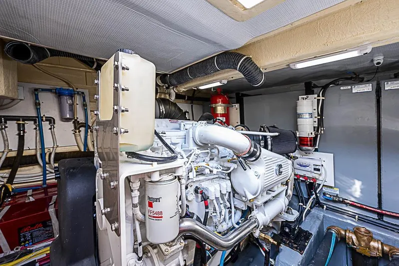  Yacht Photos Pics Engine room of 2017 Carver C52 Coupe yacht, showcasing mechanical components and systems.