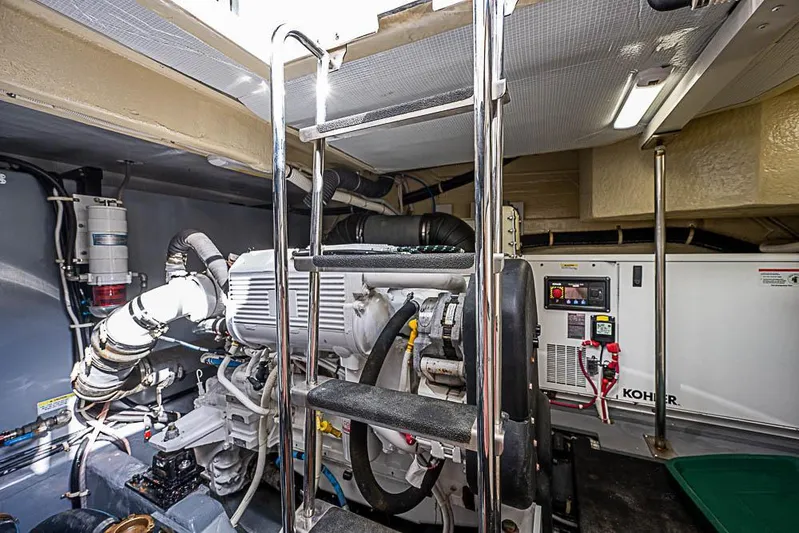  Yacht Photos Pics Engine room of 2017 Carver C52 Coupe yacht, featuring machinery and equipment.