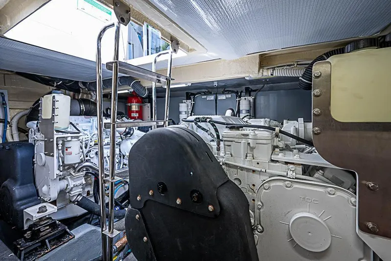  Yacht Photos Pics Engine room of 2017 Carver C52 Coupe yacht, featuring complex machinery and equipment.