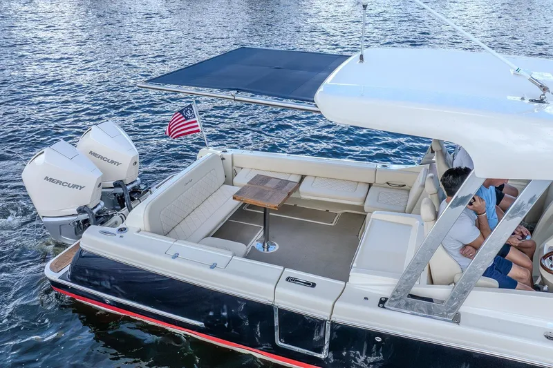 Ritz-sea Yacht Photos Pics 2019 Chris-Craft Calypso 30 boat with Mercury engines on water, featuring spacious seating.