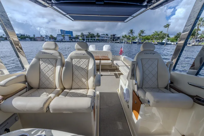 Ritz-sea Yacht Photos Pics Luxurious 2019 Chris-Craft Calypso 30 boat interior with plush seating and waterfront view.