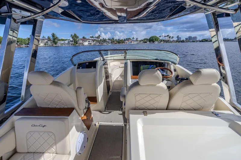 Ritz-sea Yacht Photos Pics 2019 Chris-Craft Calypso 30 boat interior with luxurious seating and waterfront view.