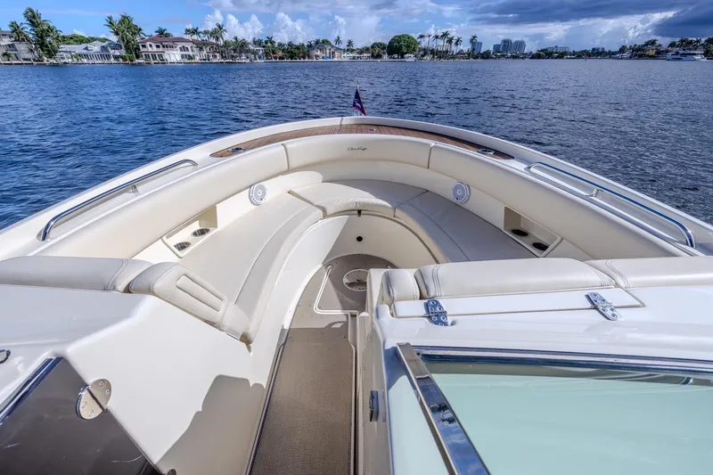Ritz-sea Yacht Photos Pics 2019 Chris-Craft Calypso 30 boat interior with luxurious seating and scenic waterfront view.