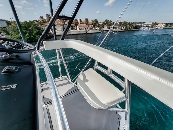 Rainmaker Yacht Photos Pics 2021 Garlington Convertible yacht deck with scenic waterfront view.