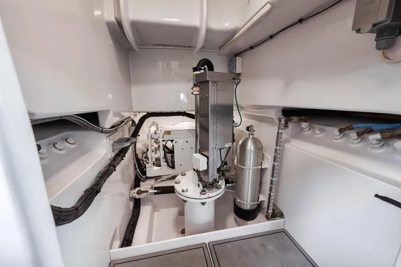 Rainmaker Yacht Photos Pics 2021 Garlington Convertible engine room with mechanical components and wiring.