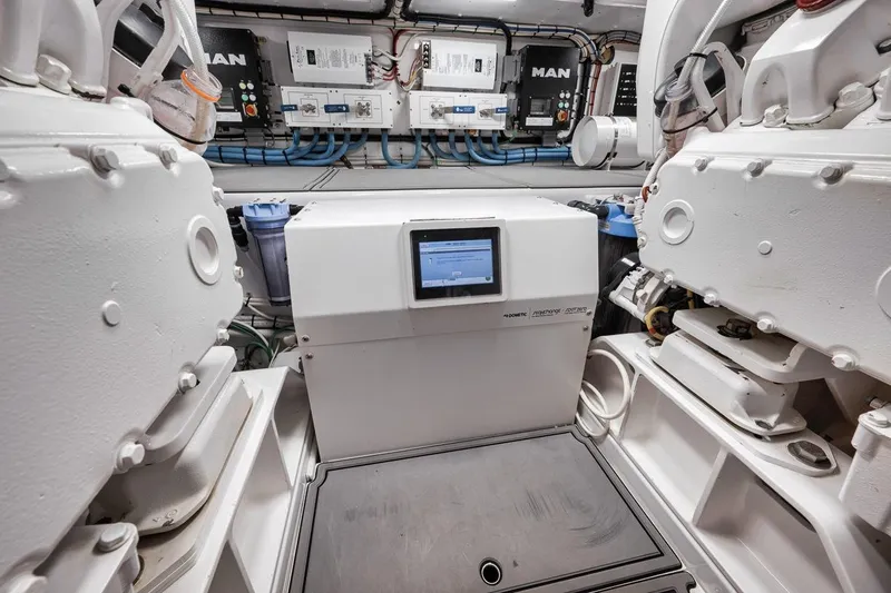 Rainmaker Yacht Photos Pics Engine room of 2021 Garlington Convertible yacht with advanced control systems and machinery.