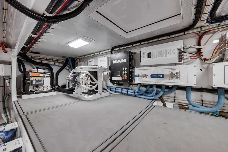 Rainmaker Yacht Photos Pics Engine room of a 2021 Garlington Convertible, featuring advanced machinery and wiring systems.