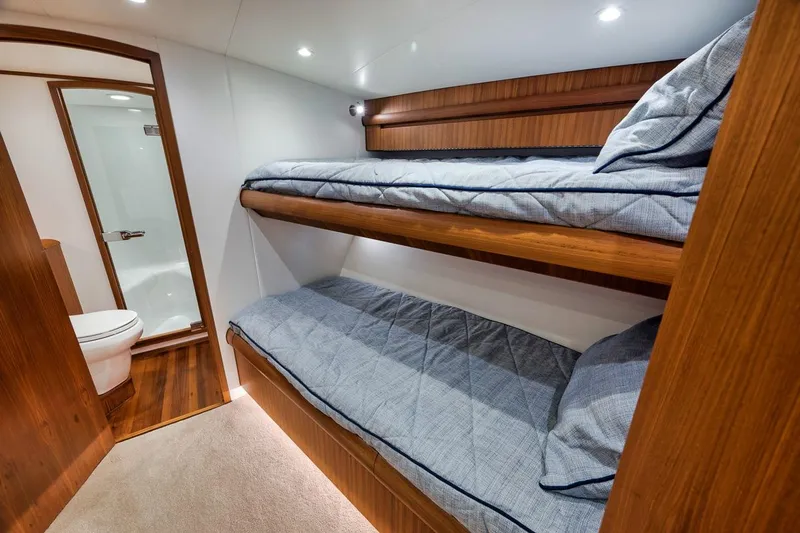 Rainmaker Yacht Photos Pics 2021 Garlington Convertible interior with bunk beds and bathroom.