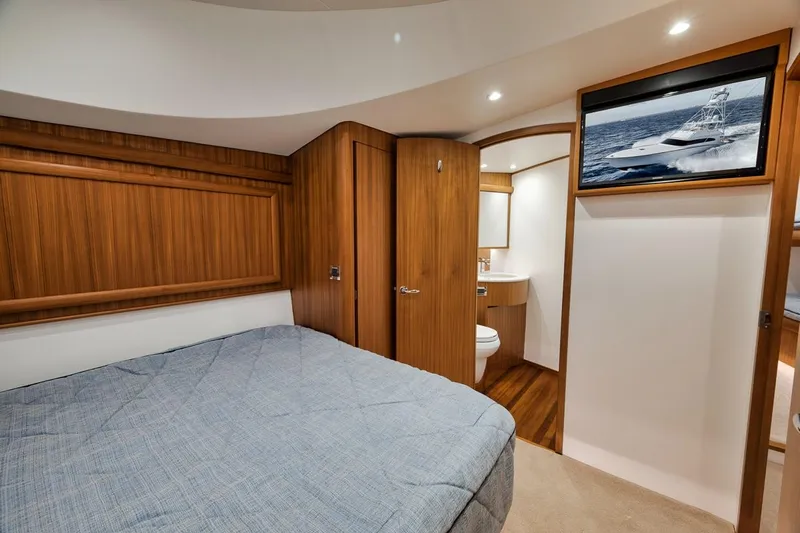 Rainmaker Yacht Photos Pics Luxurious 2021 Garlington Convertible yacht cabin with wood accents and modern amenities.