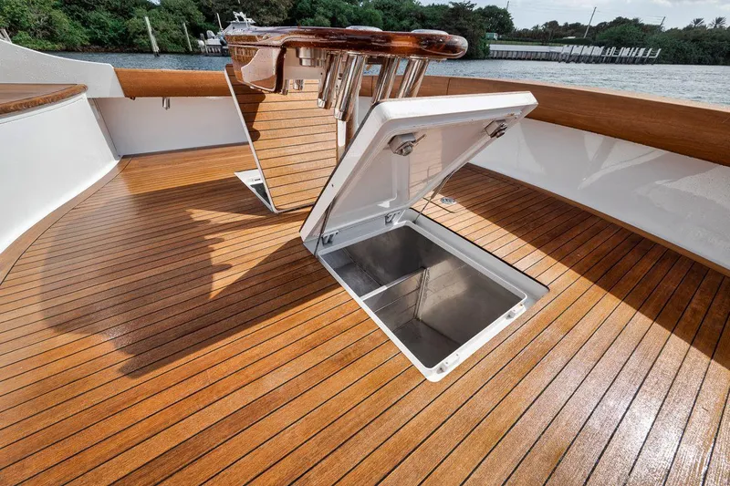 Rainmaker Yacht Photos Pics 2021 Garlington Convertible yacht with open deck hatch, showcasing sleek wooden flooring.