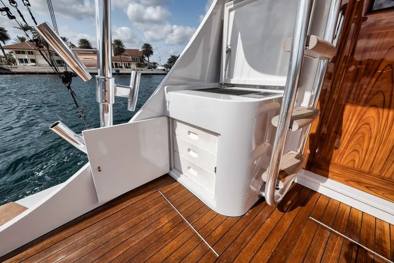 Rainmaker Yacht Photos Pics 2021 Garlington Convertible yacht interior with wooden deck and storage drawers.