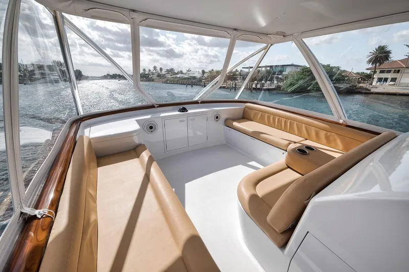 Rainmaker Yacht Photos Pics 2021 Garlington Convertible boat interior with tan seating, cruising on a sunny day.