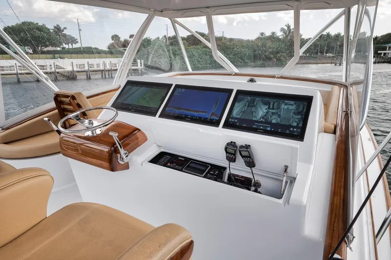 Rainmaker Yacht Photos Pics 2021 Garlington Convertible boat helm with advanced navigation screens and controls.