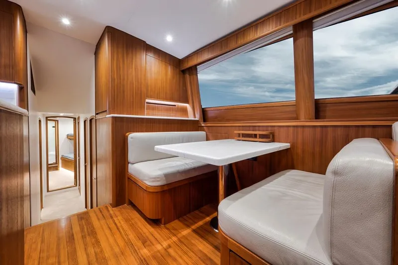 Rainmaker Yacht Photos Pics Luxurious 2021 Garlington Convertible yacht interior with elegant wood finish and plush seating.