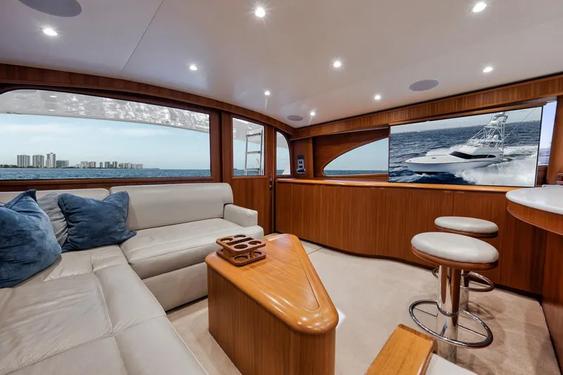 Rainmaker Yacht Photos Pics Luxurious 2021 Garlington Convertible yacht interior with plush seating and ocean view.