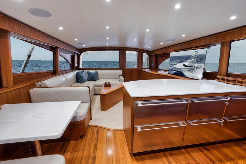 Rainmaker Yacht Photos Pics Luxurious 2021 Garlington Convertible yacht interior with elegant wood finishes and ocean view.