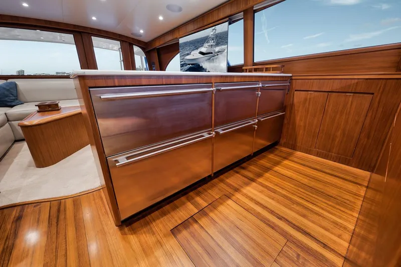 Rainmaker Yacht Photos Pics Luxurious interior of 2021 Garlington Convertible yacht with polished wood finishes and modern design.