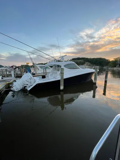  Yacht Photos Pics 2021 Jupiter 41 SB boat docked at sunset, calm waters, scenic background.