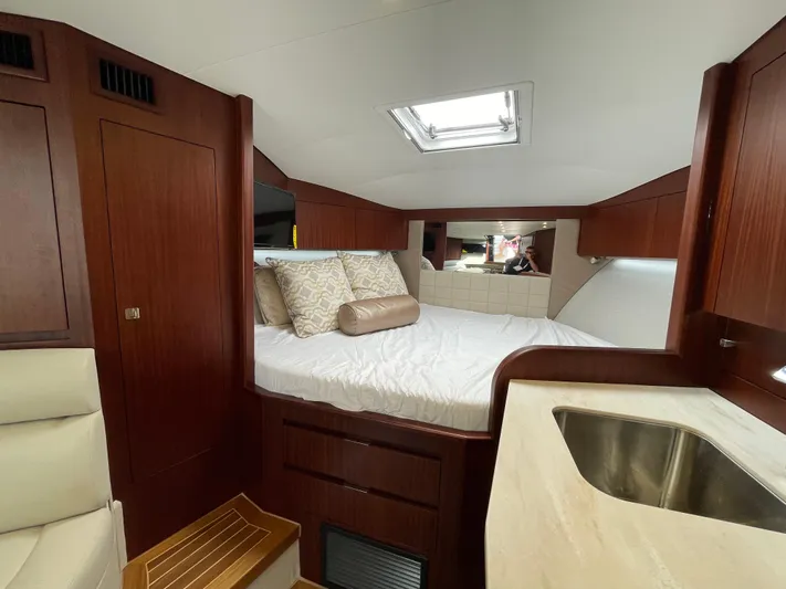  Yacht Photos Pics Luxurious cabin interior of 2021 Jupiter 41 SB yacht with bed and sink.