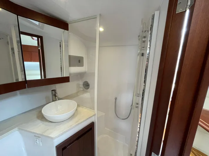  Yacht Photos Pics Luxurious bathroom in 2021 Jupiter 41 SB yacht with modern fixtures and elegant design.