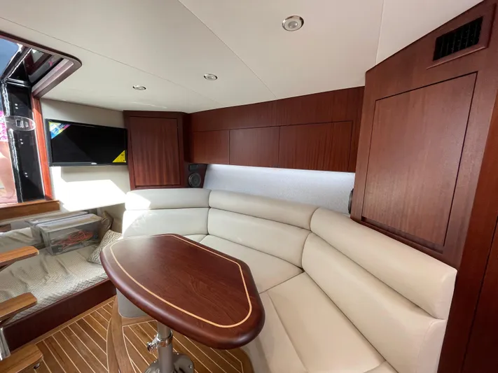  Yacht Photos Pics Luxurious interior of 2021 Jupiter 41 SB yacht with elegant seating and wood finishes.