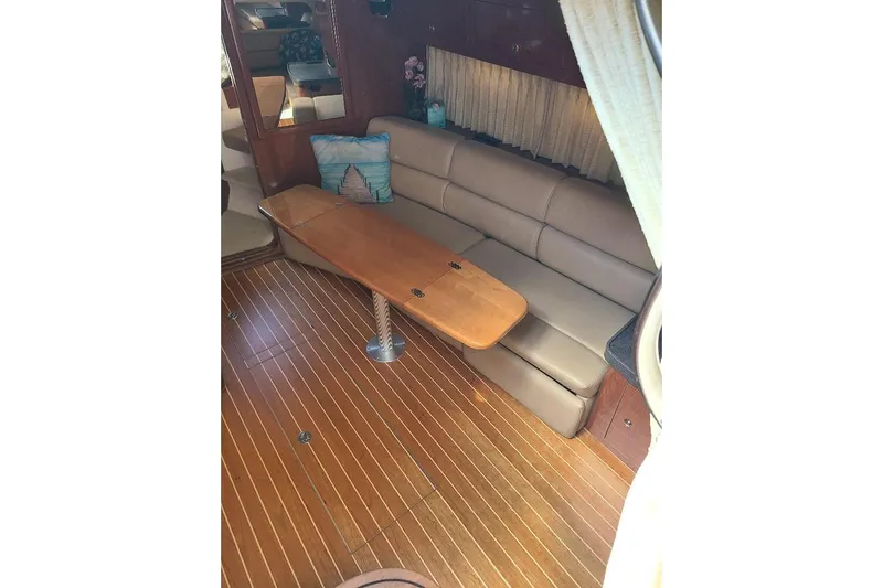  Yacht Photos Pics 2009 Regal Commodore 3760 IB interior with leather seating and wooden table.