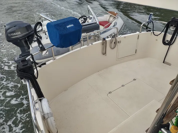 Snowy Owl Yacht Photos Pics Nordic Tug 42 boat deck, Yamaha motor, and water view, 2000 model.