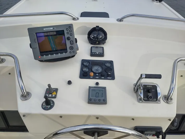 Snowy Owl Yacht Photos Pics Nordic Tug 42 helm station with navigation equipment and controls, year 2000 model.
