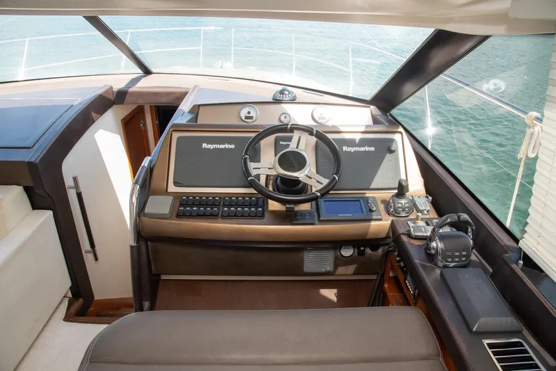  Yacht Photos Pics Helm of 2013 Prestige 500 S yacht with Raymarine navigation system.