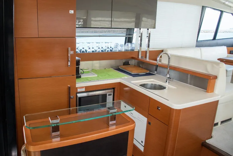  Yacht Photos Pics Modern kitchen interior on a 2013 Prestige 500 S yacht, featuring sleek cabinetry and appliances.