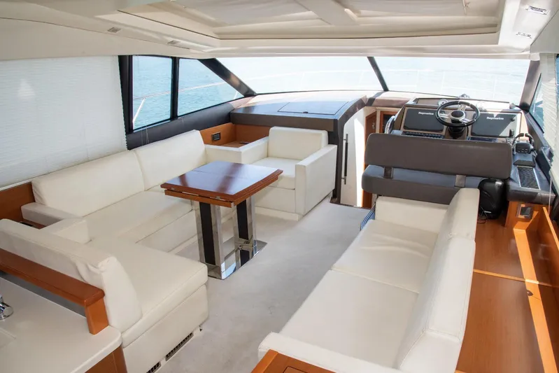  Yacht Photos Pics Luxurious interior of a 2013 Prestige 500 S yacht with elegant seating and helm.
