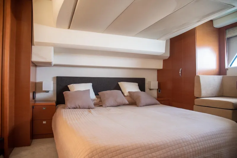  Yacht Photos Pics Luxurious bedroom interior on a 2013 Prestige 500 S yacht, featuring a comfortable bed.