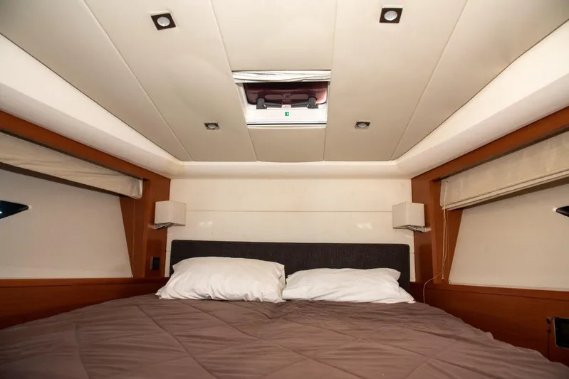  Yacht Photos Pics Luxurious cabin interior of 2013 Prestige 500 S yacht with cozy bedding.