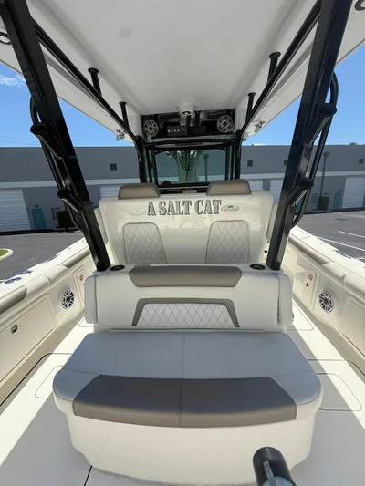  Yacht Photos Pics 2023 World Cat 325 CC boat interior with seating and "A Salt Cat" text.