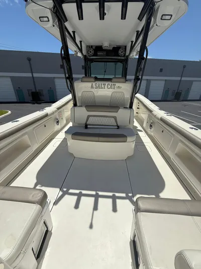  Yacht Photos Pics 2023 World Cat 325 CC boat interior with seating and storage compartments.