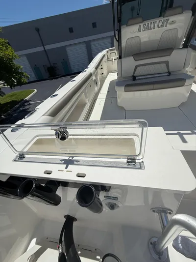  Yacht Photos Pics 2023 World Cat 325 CC boat interior with seating and storage compartments.